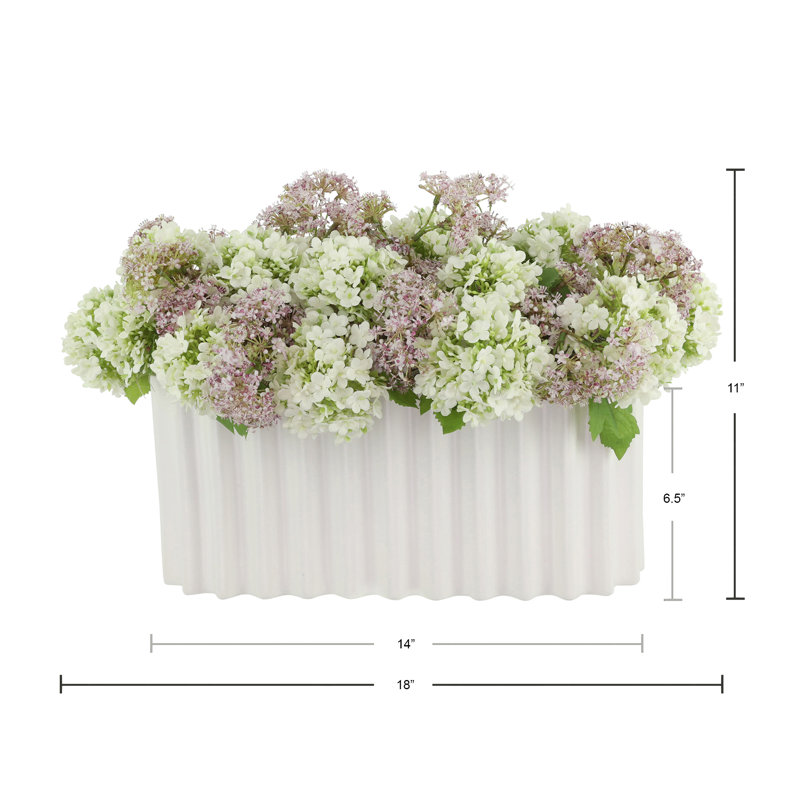 Viburnum and Weeping Laurel Arranged in a Ceramic Vase