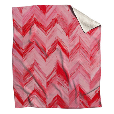 Couvertures à chevrons rouges et roses
