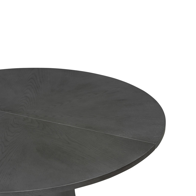 Table de salle à manger ronde en chêne gris de 100 cm (39,4 po) avec finition patinée à la main, favorisant les échanges conviviaux. Son grain floral naturel la rend idéale pour les repas intimes.