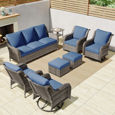 A Three-Seater Sofa + Two Swivel Chairs + Two Armchairs + Two Footstools + Two Side Tables
