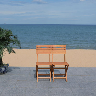Ungar Folding Patio Dining Chair by Highland Dunes