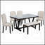 Table de salle à manger moderne en pierre artificielle avec bord incurvé et pieds en métal gris foncé, pouvant accueillir six personnes pour des repas élégants