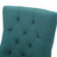 Luxueux fauteuil rembourré en velours avec dossier capitonné et structure en bois robuste, pour ajouter une touche d'élégance à tout espace de vie.-1026521444