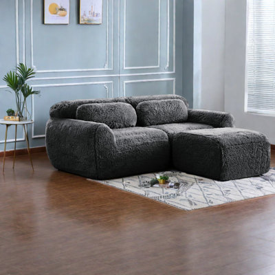 Canapé ergonomique confortable, tissu gris foncé moelleux, idéal pour les chambres à coucher