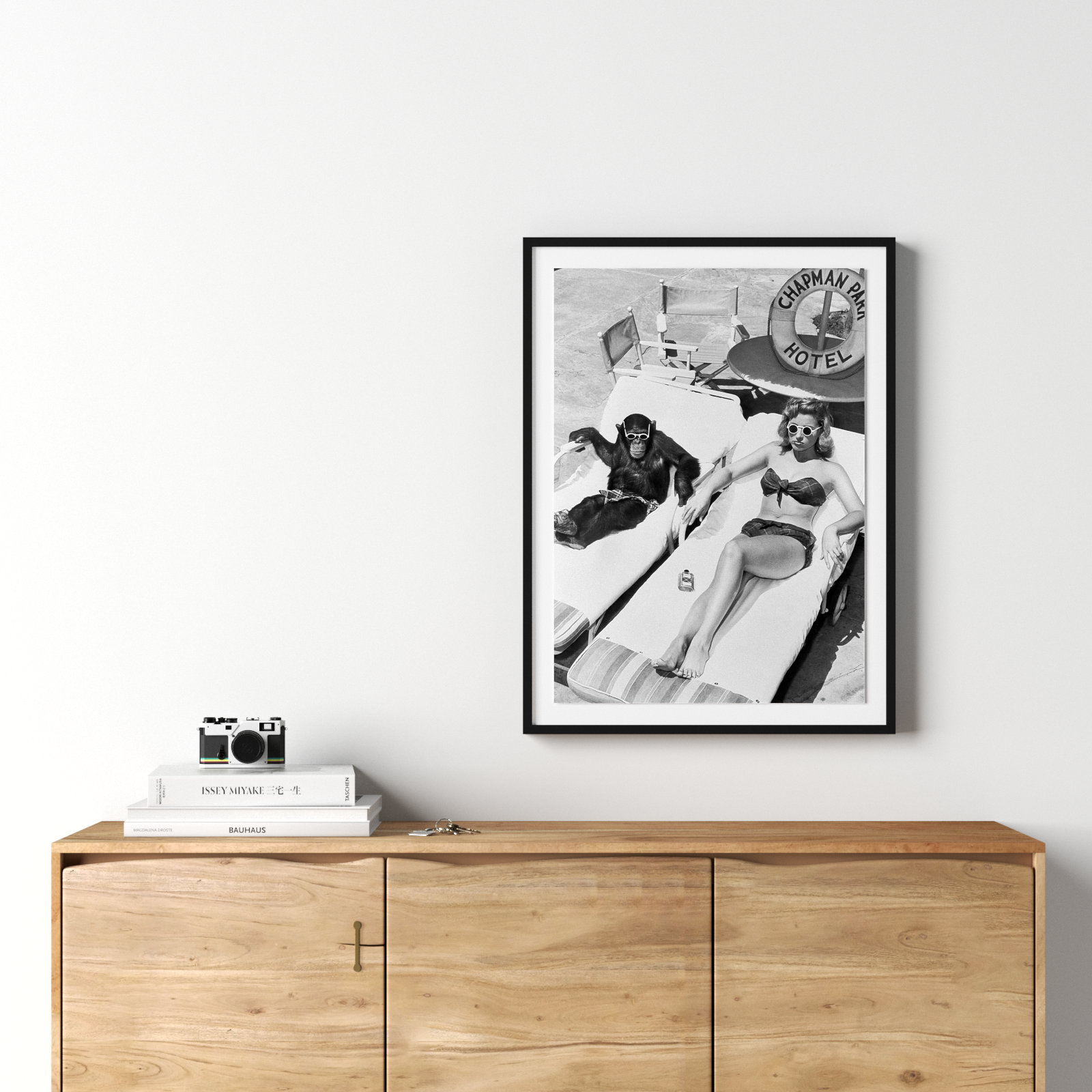 Woman Sunbathing With Chimpanzee by Getty Images, 32" H x 24" W, Black Maple Framed