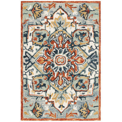 Vahakn Hand Tufted Wool/Cotton Southwestern Rug in Blue/Rust