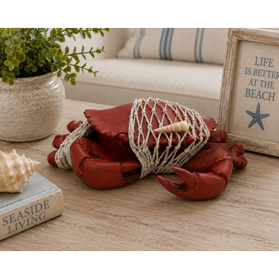 Figurine crabe dans un filet de pêche