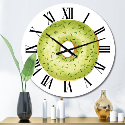 Beignet vert avec paillettes sur fond blanc - Horloge murale décontractée