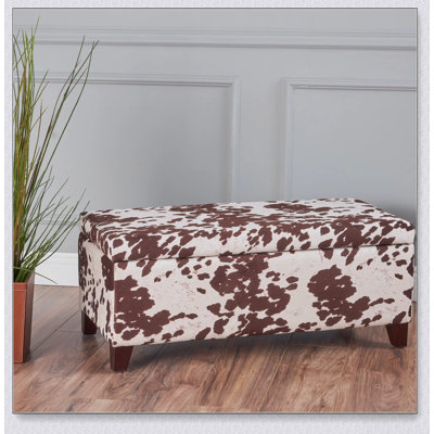 Repose-pieds de rangement moderne avec compartiment caché, parfait pour l'organisation du salon et des sièges supplémentaires.