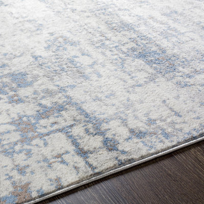 Tapis abstrait bleu / gris clair / blanc Magallanes