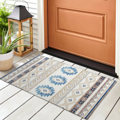 Tapis ivoire / bleu en polyester tissé à la machine Mentzer Southwestern
