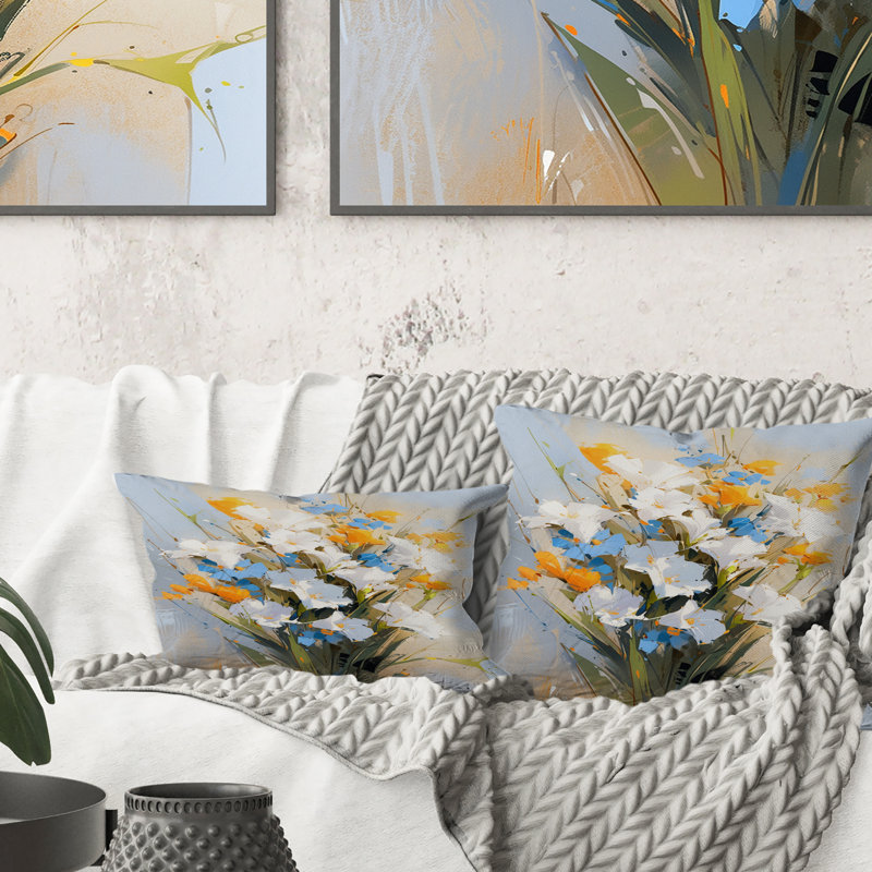 Coussin décoratif à imprimé floral bleu et blanc