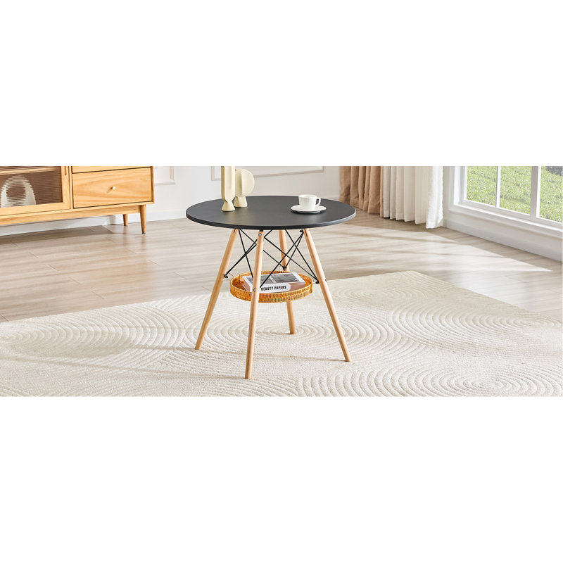 Table de salle à manger circulaire de 31,5 pouces de diamètre, plateau en panneau de fibres à densité moyenne noir, pieds en bois massif, avec structure de panier de rangement suspendue. Une table basse décontractée pouvant accueillir de 2 à 4 personnes.