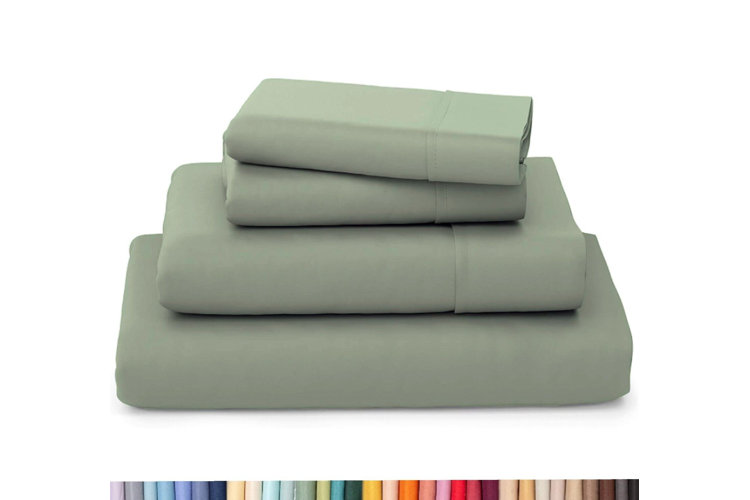 A set of green bamboo cooling sheets, including a fitted and flat sheet and two pillowcases.