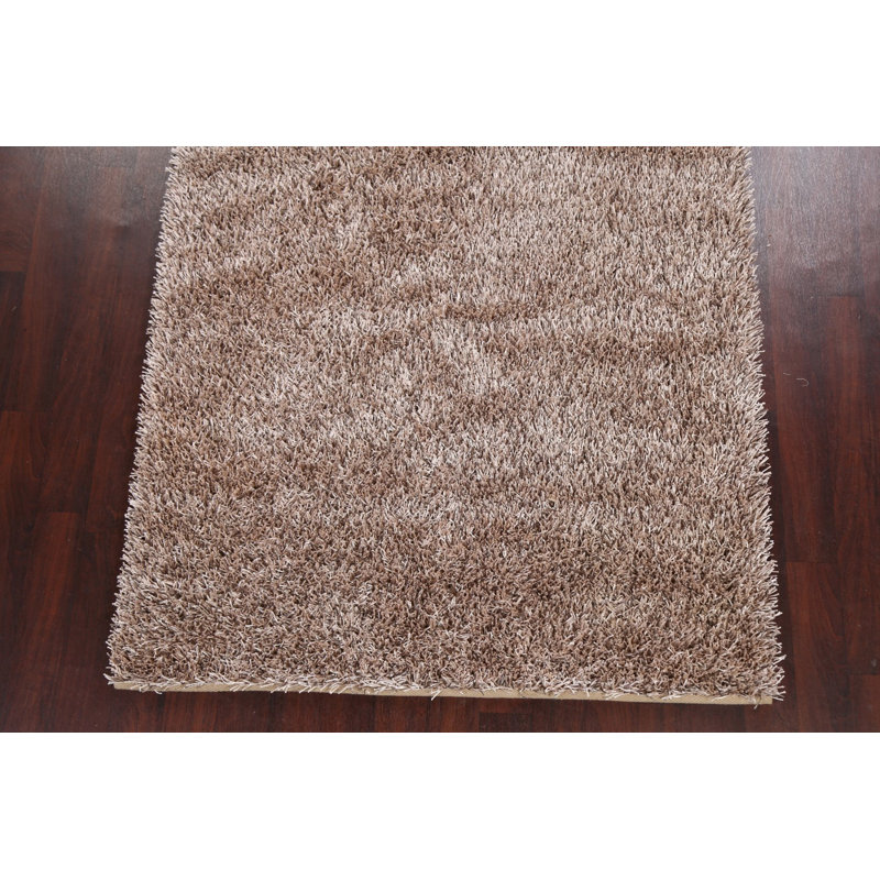 Tapis beige touffeté à la main