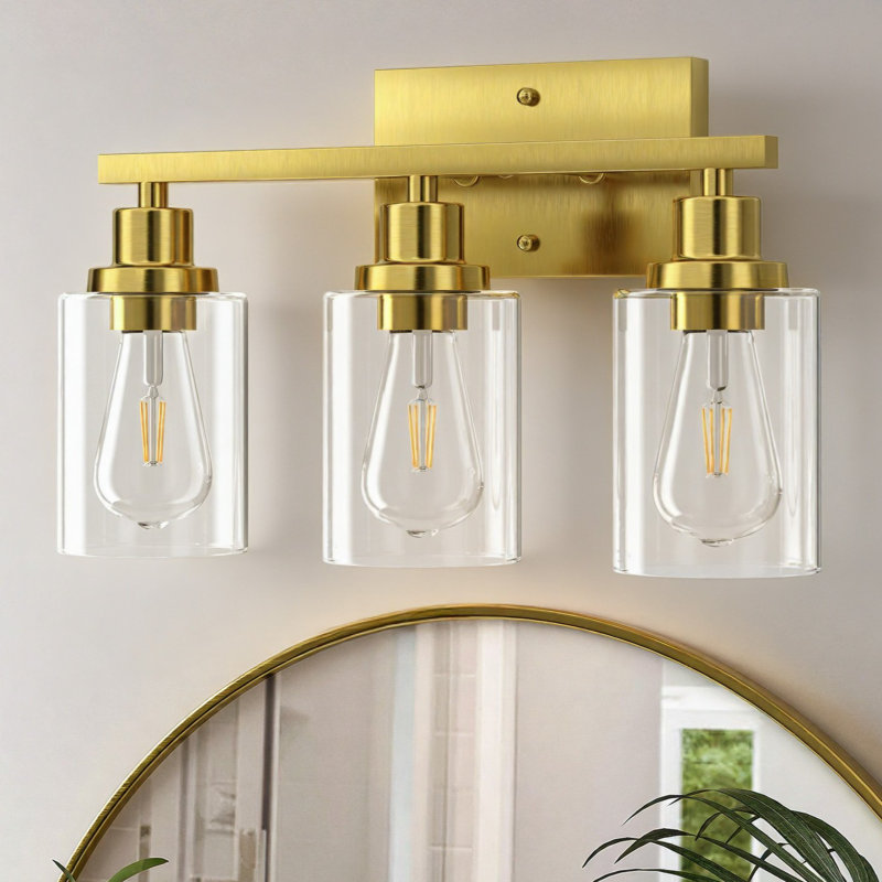 Éclairage pour salle de bain 3 lumières 19,5 po en or brossé avec abat-jour en verre transparent et contre-plaque rectangulaire
