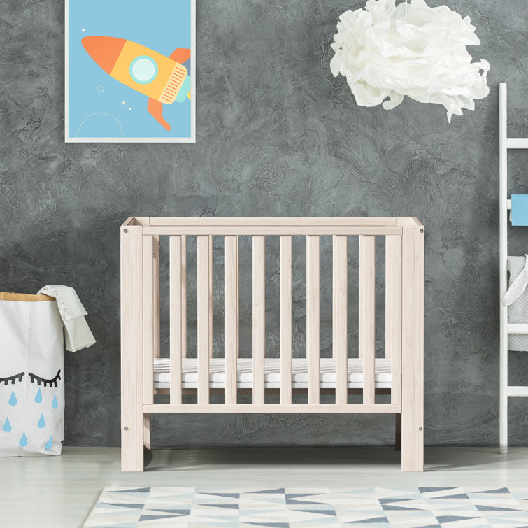 EvoNest 6-in-1 Portable Convertible Cradle to Mini Crib With Removable Wheels and Mattress