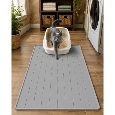 At 34 x 22 in, this silicone cat litter mat uses raised edges to lock in litter and urine; the scratch- and wear-resistant surface is easy to clean, the backing is non-slip, and the mat fits most standard boxes.