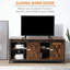 Meuble télé Gracie Oaks pour téléviseur de 60 po ou moins, console de télévision avec rangement et 2 portes de grange coulissantes, unité de divertissement autoportante pour le salon, brun