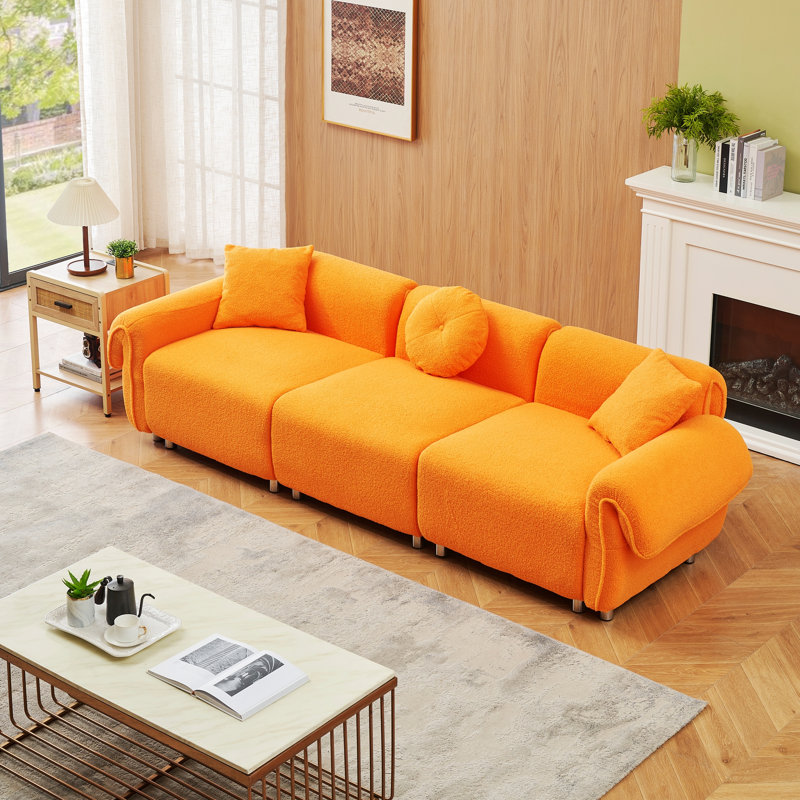 Ivy Bronx 112" Modern Curved Sofa, Back Upholstered Couch with 3 Decorative Throw Pillows, Orange Teddy 