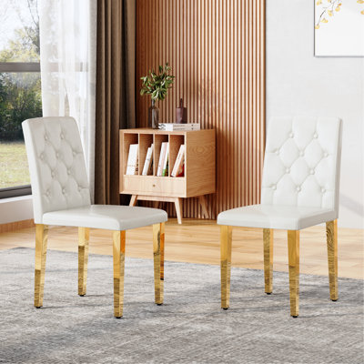 Ensemble de 2 chaises de salle à manger en polyuréthane blanc: dossier ergonomique à boucle, hauteur de 35 pouces, pieds en métal doré, alliant confort et texture. Parfaitement adapté aux salles à manger familiales, aux salles de banquet d'hôtel, etc.