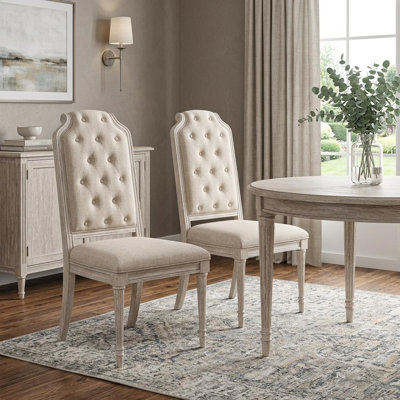 Ensemble de deux chaises d'appoint en tissu capitonné blanc et champagne