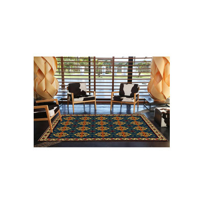 Tapis bleu délavé à motif frangé traditionnel