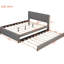 Lit plateforme tapissier très grand en lin gris et lit simple TG avec tête de lit à motif brique, lit stable, structure en bois