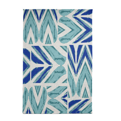 Tapis décoratif bleu sarcelle géométrique