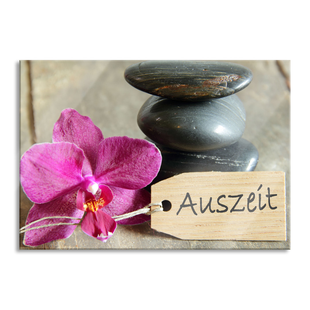 Glasbild Auszeit Orchidee mit Zen-Steinen