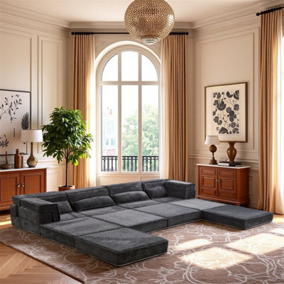 Très grand canapé modulaire sans os à quatre places avec repose-pieds