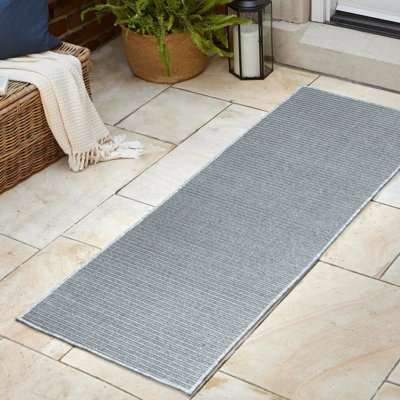 Tapis intérieur / extérieur rayé bleu / ivoire Ryandh High-Low Minimalist