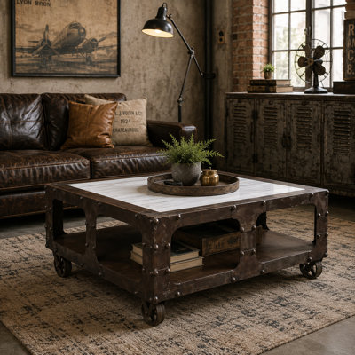 Lakela Reclaimed Shipwreck Iron Coffee Table with Marble Top & Industrial Wheels
