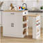 Console d'îlot extensible avec tiroirs, armoire à deux portes et tablettes ouvertes. Sert de table à manger, de bar pour le petit-déjeuner temporaire et de salon de thé l'après-midi, blanc