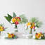 Agencement floral en rose et vert à tournesol en vase