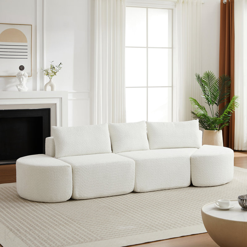 Ensemble de canapé modulaire en forme de V en chenille, comprenant trois coussins décoratifs et deux repose-pieds courbés, idéal pour les salons, les chambres et les bureaux.