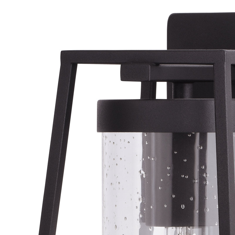 Adéla 13.75 in. H 1-Light Textured Black Dusk to Dawn Sensor Outdoor Wall Sconce, Durable Steel, Clear Seeded Glass Shade, LED Compatible for Exterior Porch Patio Front Door or Garage