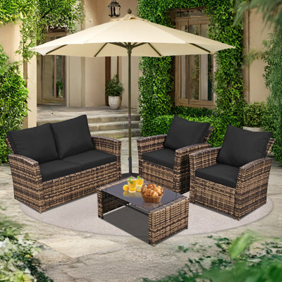 Ensemble de meubles de patio en osier 4 pièces avec coussins, ensemble de conversation extérieur avec cadre en fer et table basse en verre pour terrasse, balcon