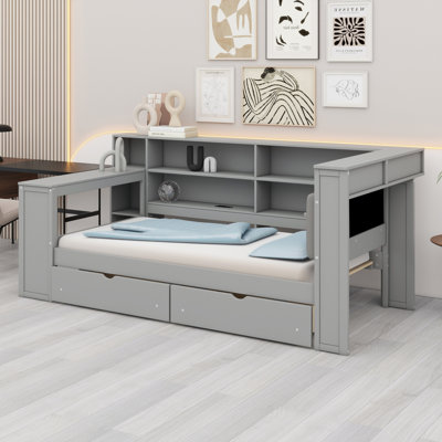 Lit plateforme en bois avec tablettes de rangement, tiroirs, station de charge, DEL, bureau et tête de lit tapissier