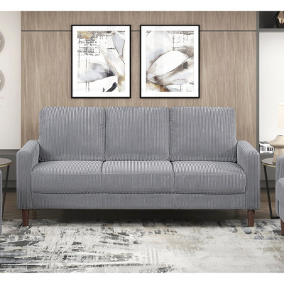 Velours côtelé gris contemporain avec siège et dossier rembourrés, accoudoirs, pieds en faux bois brun pour un salon confortable avec coussins