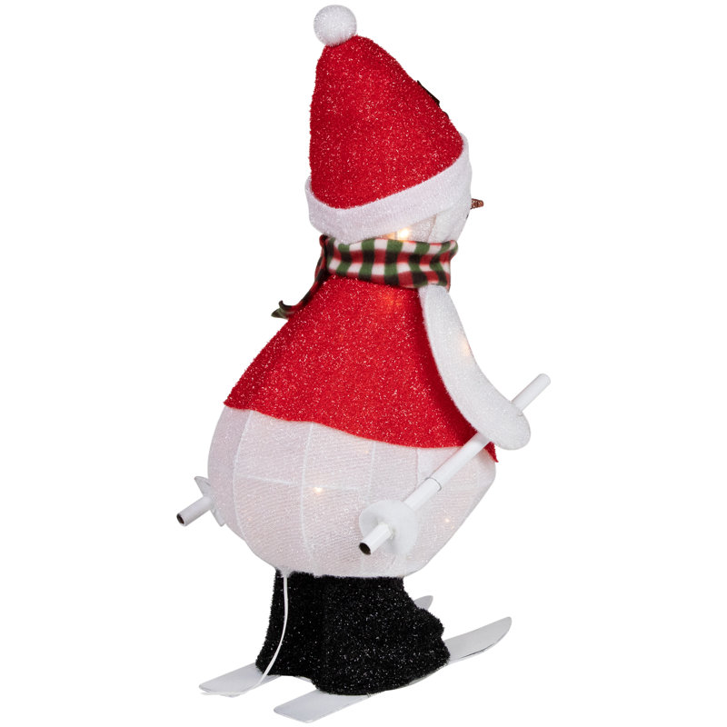 Silhouette de bonhomme de neige skiant