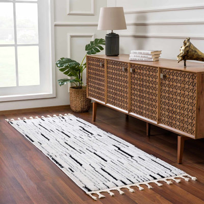 Jdan Striped Machine Woven Polypropylene Area Rug in Black