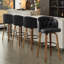 Tabouret de bar pivotant avec pieds en bois courbés, dossier capitonné et garniture cloutée-1869183648-1869183649