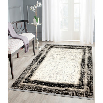 Tapis gris / crème en polypropylène / polyester touffeté à la main Freedom