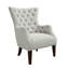 Fauteuil à oreilles capitonné