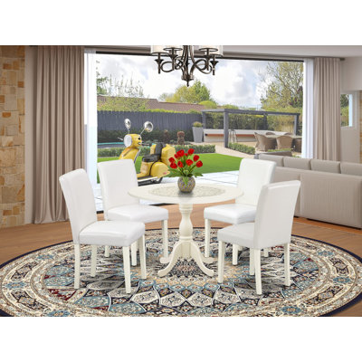 L'ensemble de table de salle à manger 5 pièces comprend une table ronde avec Dropleaf et 4 chaises Parson revêtues de similicuir blanc, lin blanc