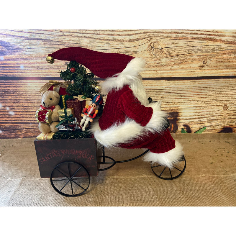 Père Noël sur chariot tricycle