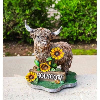 Figurine de vache de l'Ouest avec des tournesols