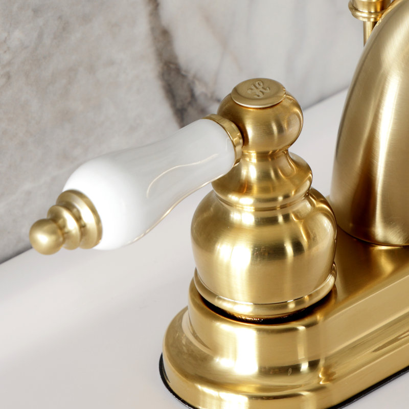 Kingston Brass Restoration Two-Handle 3-Hole Deck Mount 4" Centerset Bathroom Faucet, Brushed Brass