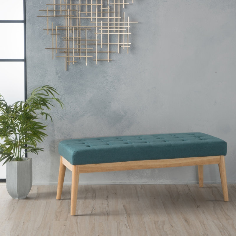 Élégant banc bleu sarcelle, revêtu d'un tissu de qualité et d'une structure texturée en bois de bouleau